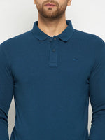 Man in a 98degreenorth Men Polo Collar Full Sleeves Teal T-shirt, standing against a light background.