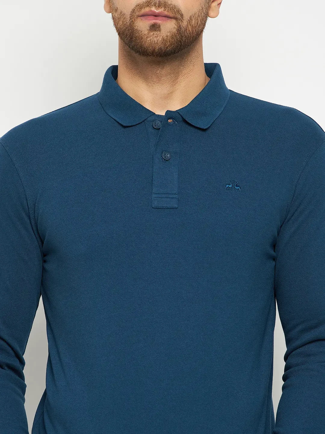 Man in a 98degreenorth Men Polo Collar Full Sleeves Teal T-shirt, standing against a light background.