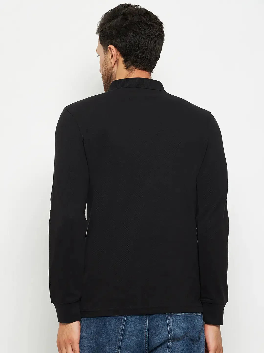 Man in 98degreenorth Men Polo Collar Full Sleeves With Pocket Black T-shirt and blue jeans, back to camera, on white.