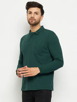 Man wearing a 98degreenorth Men Polo Collar Full Sleeves With Pocket Dark Green T-shirt and black pants.
