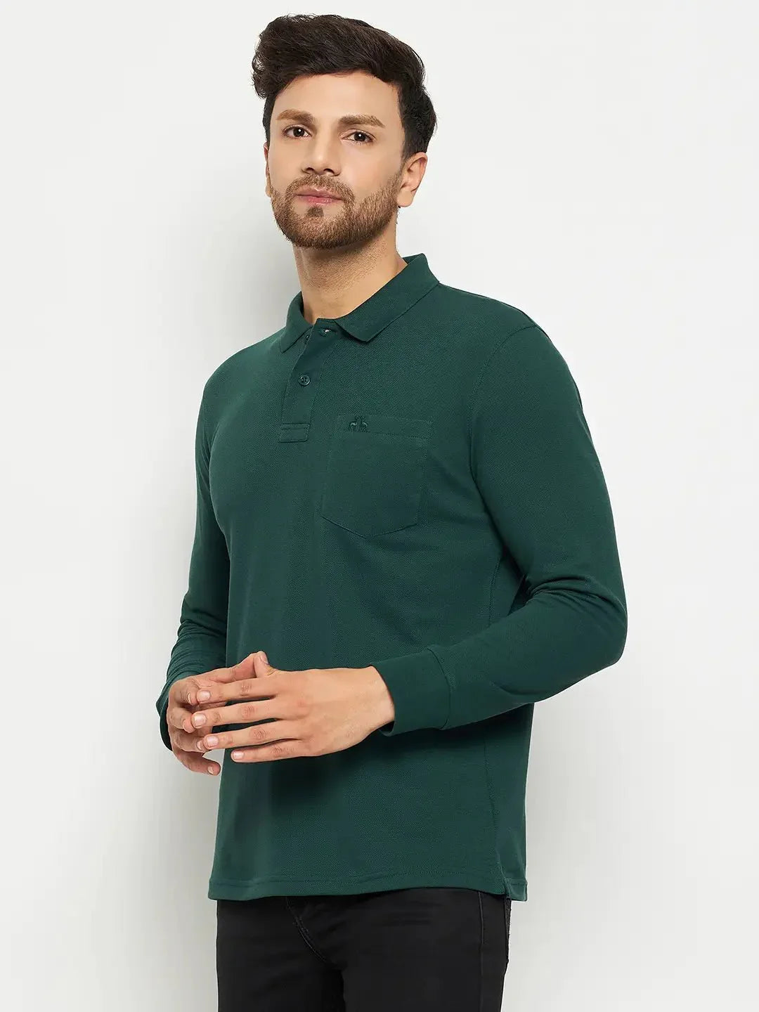 Man wearing a 98degreenorth Men Polo Collar Full Sleeves With Pocket Dark Green T-shirt and black pants.