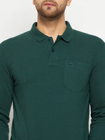 A man in a 98degreenorth Men Polo Collar Full Sleeves With Pocket Dark Green T-shirt with embroidered logo.