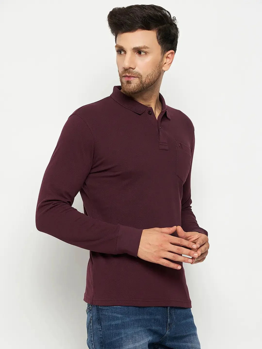 Man wears 98degreenorth Men Polo Collar Full Sleeves With Pocket Dark Wine T-shirt with blue jeans, on white background.