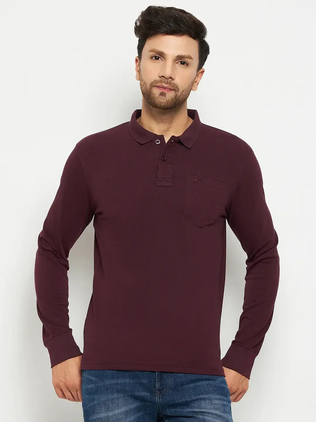 Man in 98degreenorth Men Polo Collar Full Sleeves With Pocket Dark Wine T-shirt and blue jeans, against white background.