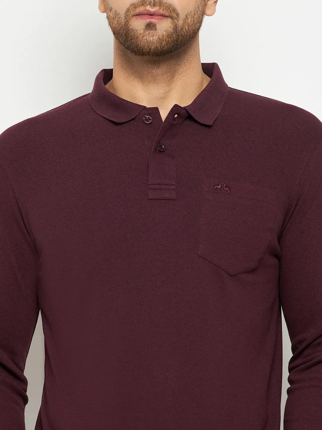 Man wearing a 98degreenorth Men Polo Collar Full Sleeves With Pocket Dark Wine T-shirt against a plain background.