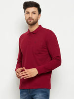 Man wears 98degreenorth Men Polo Collar Full Sleeves With Pocket Maroon T-shirt and blue jeans—ideal for travel.