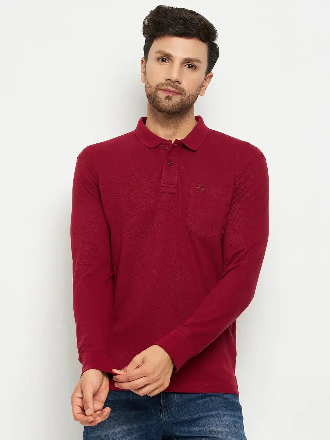 Man in 98degreenorth Men Polo Collar Full Sleeves With Pocket Maroon T-shirt and blue jeans, ideal for travel.