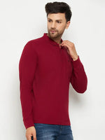 Man wearing a 98degreenorth Men Polo Collar Full Sleeves With Pocket Maroon T-shirt and blue jeans against white background.