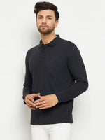 Man wearing a 98degreenorth Men Polo Collar Full Sleeves With Pocket Navy T-shirt and white pants, against a plain background.