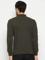 A man in a 98degreenorth Men Polo Collar Full Sleeves With Pocket T-shirt - Olive and black jeans, back to camera.