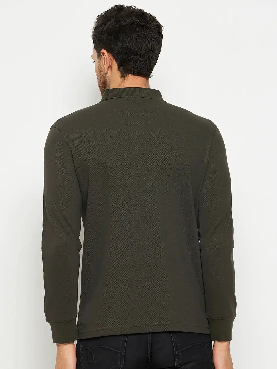 A man in a 98degreenorth Men Polo Collar Full Sleeves With Pocket T-shirt - Olive and black jeans, back to camera.