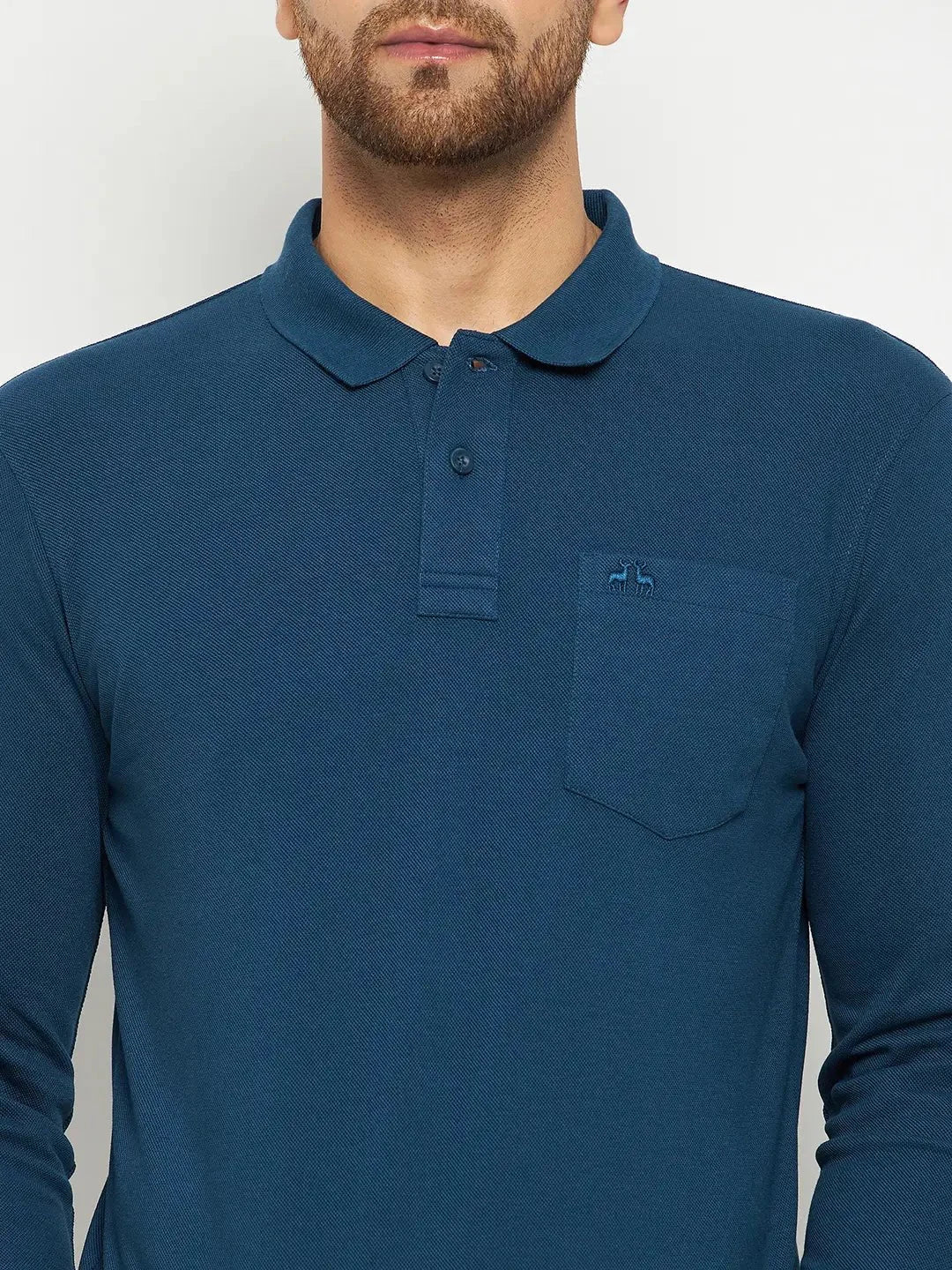 Man wearing a 98degreenorth Men Polo Collar Full Sleeves With Pocket Teal T-shirt, against a plain background.