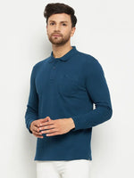 Man in a 98degreenorth Men Polo Collar Full Sleeves With Pocket Teal T-shirt and white pants against a white background.