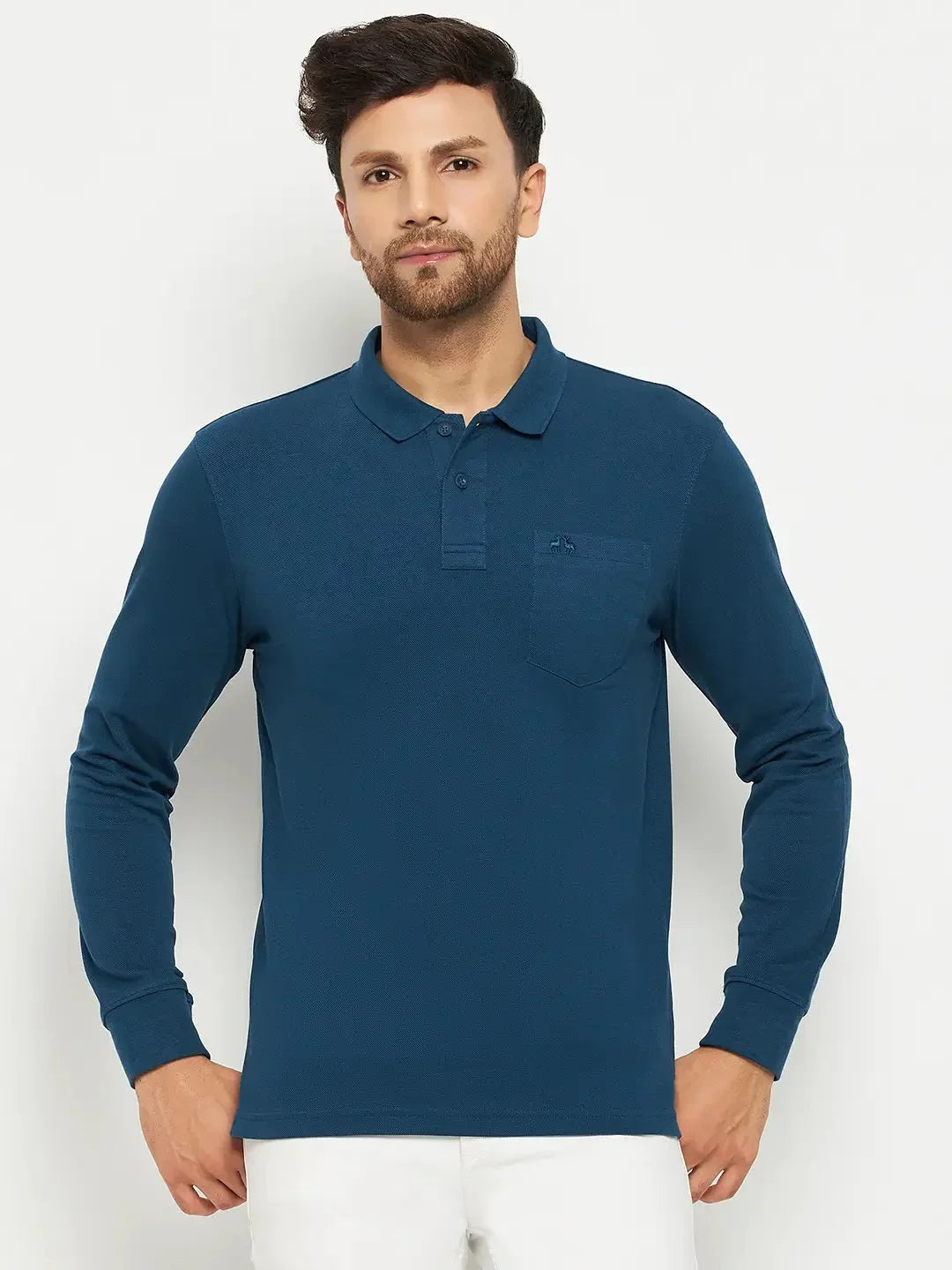 A man in a teal Men Polo Collar Full Sleeves T-shirt with pocket by 98degreenorth.