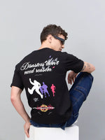 Man in sunglasses wears a 98degreenorth Men Typography Black Printed Round Neck T-shirt with bold, colorful graphics.