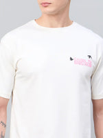 Man wearing a 98degreenorth Men Typography Printed Offwhite Round Neck T-shirt with small birds on the chest.