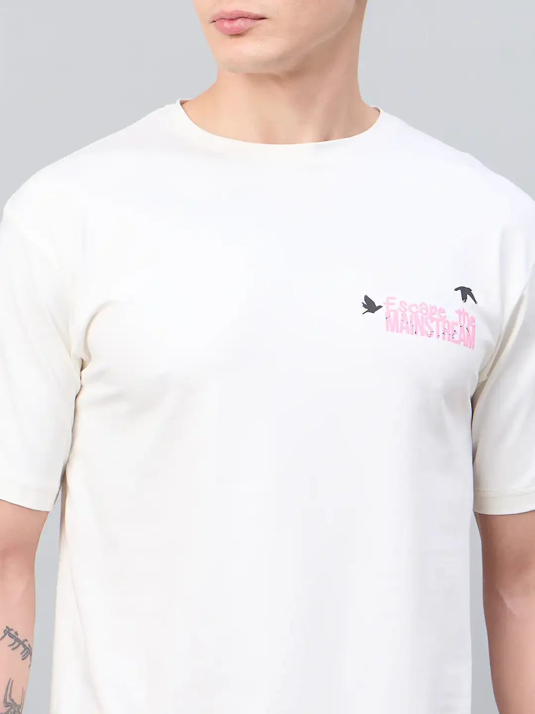Man wearing a 98degreenorth Men Typography Printed Offwhite Round Neck T-shirt with small birds on the chest.