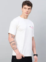Man in a 98degreenorth Men Typography Printed Offwhite Round Neck T-shirt, hand in pocket, looks to the side.