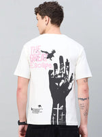 Man in 98degreenorth Men Typography Printed Offwhite Round Neck T-shirt with bold black hand, bird print, and pink text.