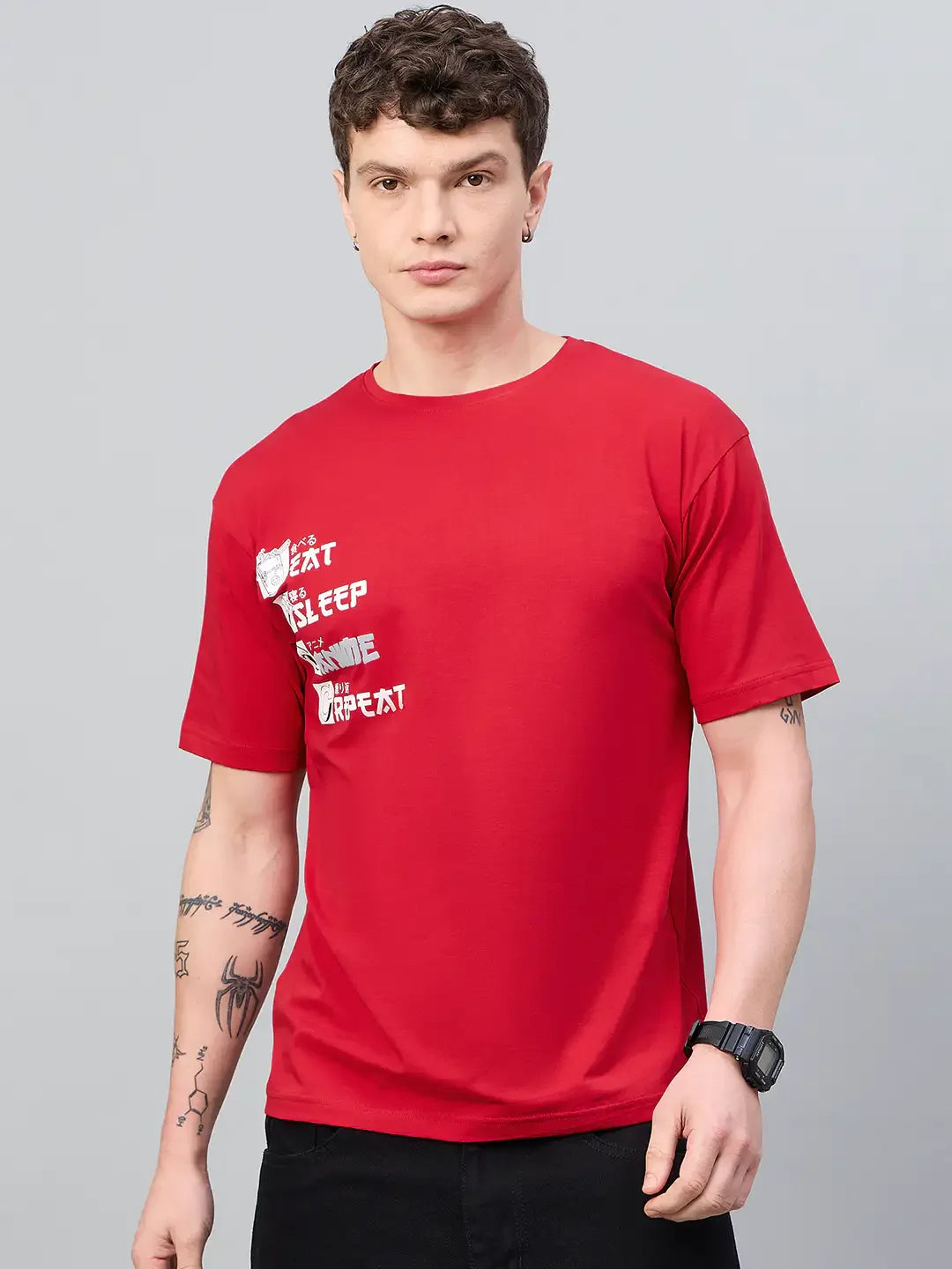 Young man in streetwear shows tattoos, wearing 98degreenorth Men Typography Printed Round Neck Red T-shirt.