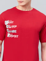 Man in a 98degreenorth Men Typography Printed Round Neck Red T-shirt, styled as trendy streetwear.
