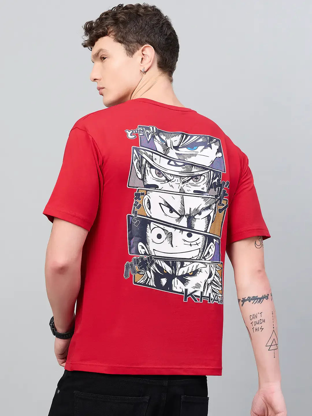 A person in a Men Typography Printed Red T-shirt by 98degreenorth, standing sideways—ideal streetwear for gamers.