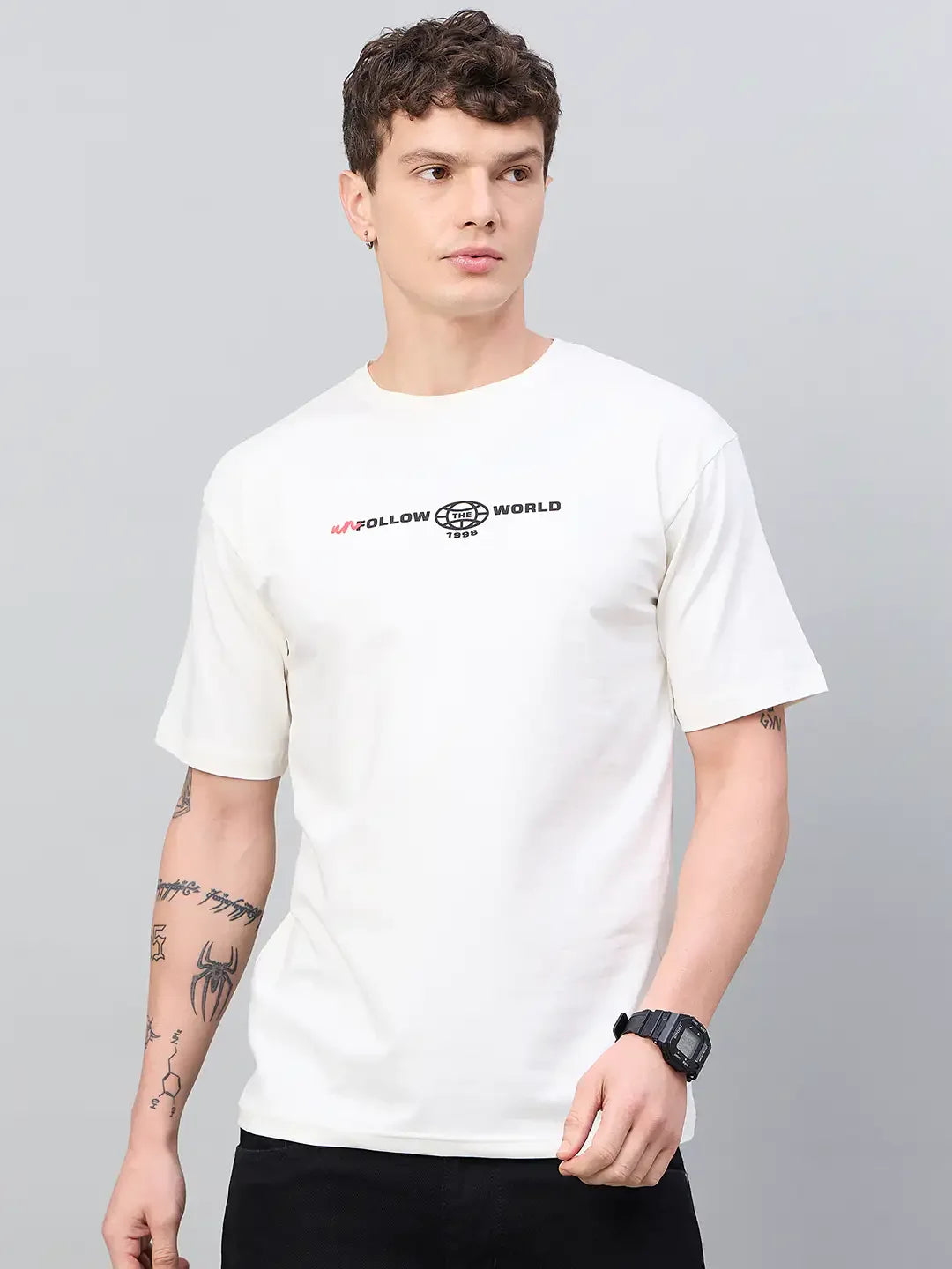 Man in 98degreenorth Men Typography Printed Round Neck T-shirt - Offwhite, looking to the side against a gray background.