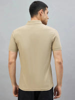 Man in 98degreenorth Men's Beige Aero Club No.3 Polo T-Shirt, back view, against a plain gray background.