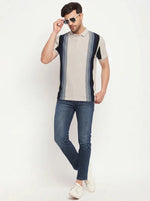 Man in 98degreenorth Beige Vertical Striped Polo T-Shirt, blue jeans & white sneakers posing against a white background.