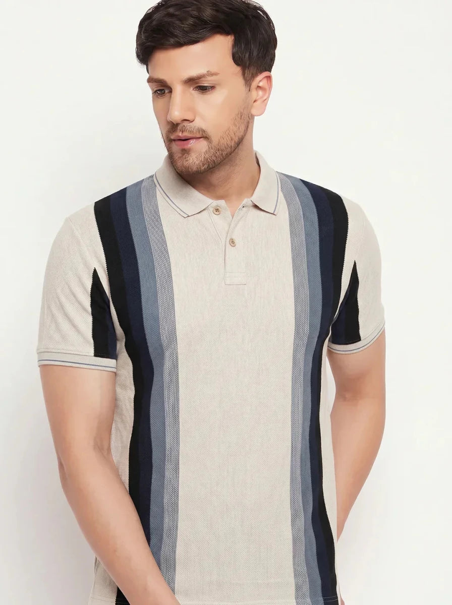 Man in 98degreenorth Men’s Beige Vertical Striped Pique Polo T-Shirt, standing against a plain light background.