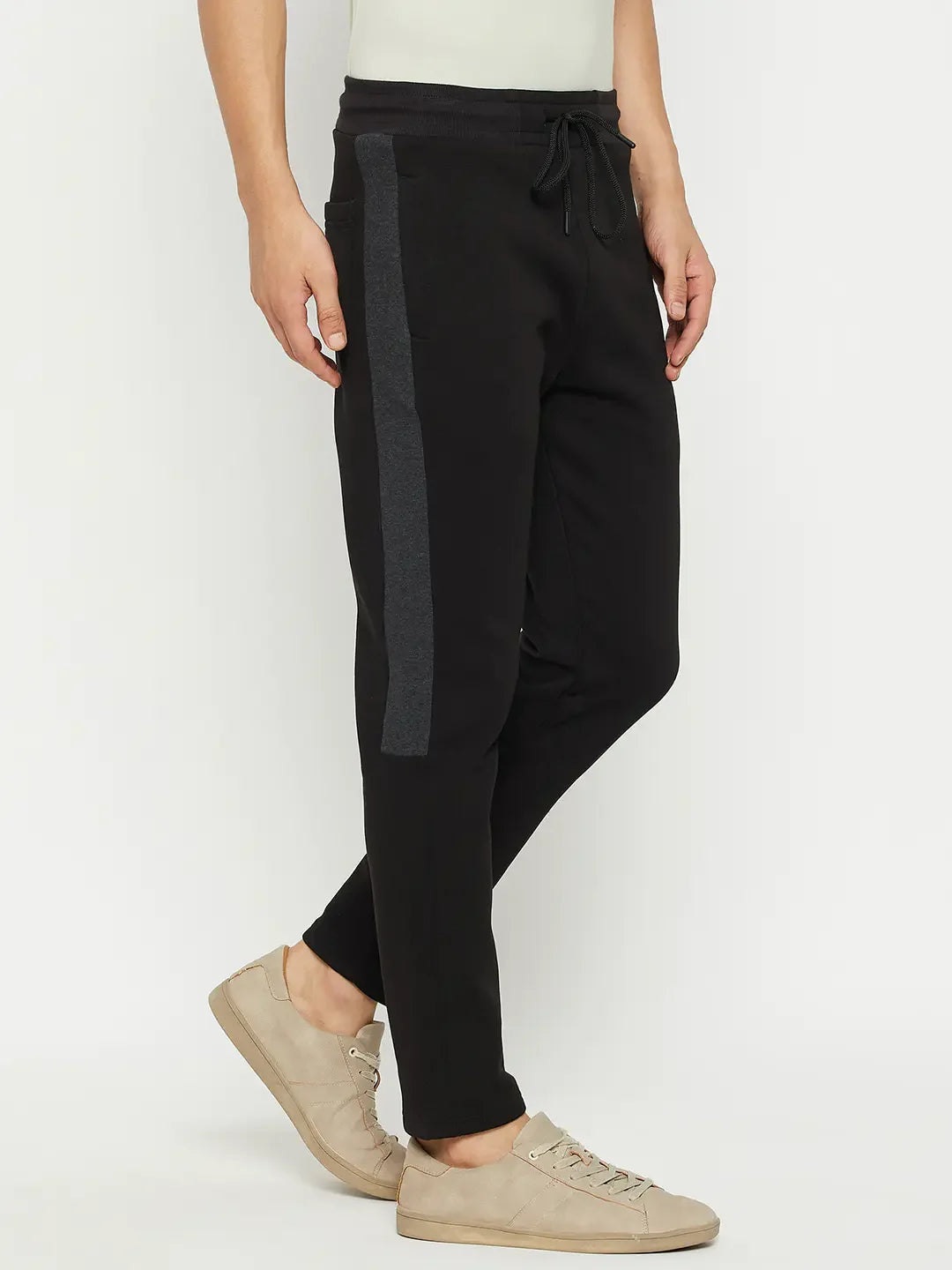 Man wearing 98degreenorth Men’s Black Fleece Trackpants with Side Design, posing against a white background.
