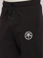 98degreenorth Men's Black French Terry Lycra Trackpants with elastic waist, drawstring & white logo on left thigh.