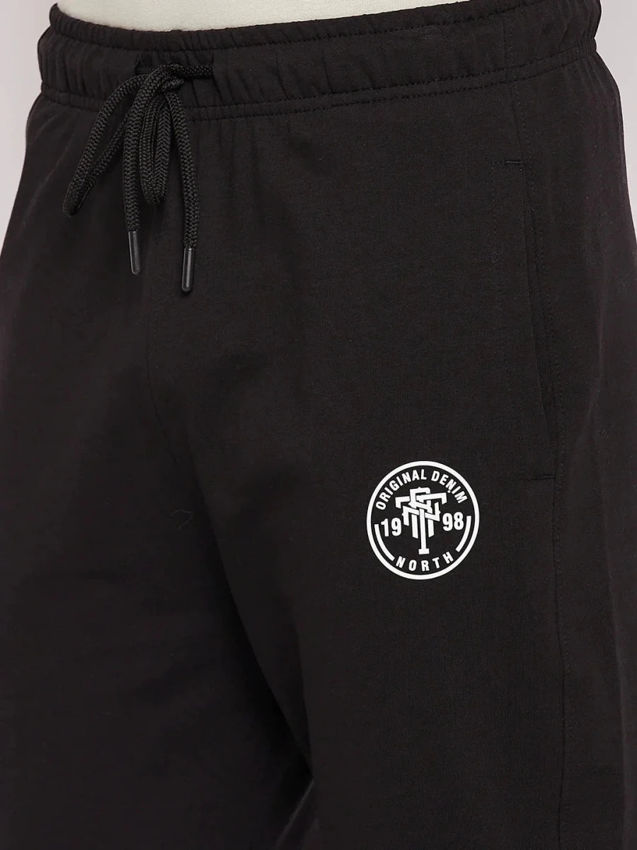 98degreenorth Men's Black French Terry Lycra Trackpants with elastic waist, drawstring & white logo on left thigh.