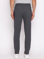 A person in 98degreenorth Men’s Black Jaspe Fleece Trackpants, shown from the back against a plain background.