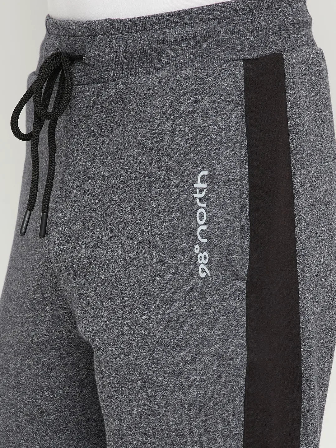 Close-up of 98degreenorth Men’s Black Jaspe Fleece Trackpants with side panel and textured dual-tone winter jogger.