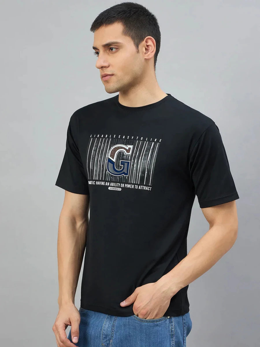 Man in a Men's Black Magnetic Graphic T-Shirt by 98degreenorth, ideal for bold streetwear style.