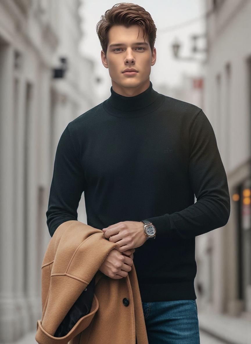 A man in a 98degreenorth Men’s Black Merino Wool Turtle Neck Sweater holds a tan coat on a city street.