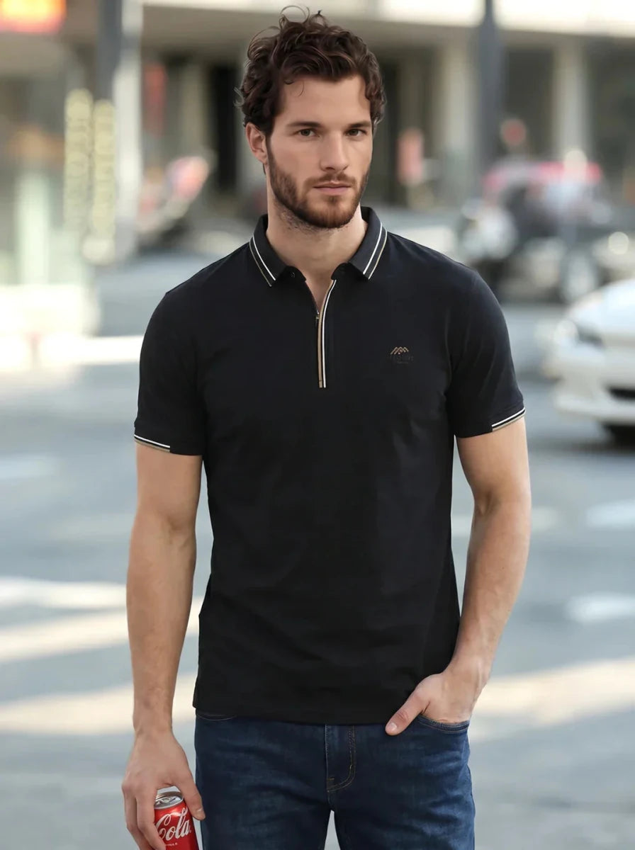 Man in a 98degreenorth Men's Black Polo T-Shirt — Handmade Series, holding a soda can on a city street.
