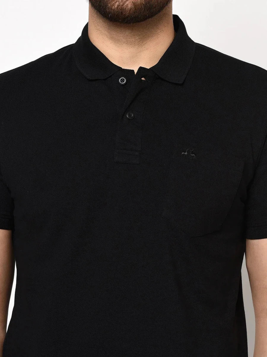 Man in 98degreenorth Men's Black Polo T-Shirt—Stretch Cotton Pique with Chest Pocket, shown shoulders to waist.