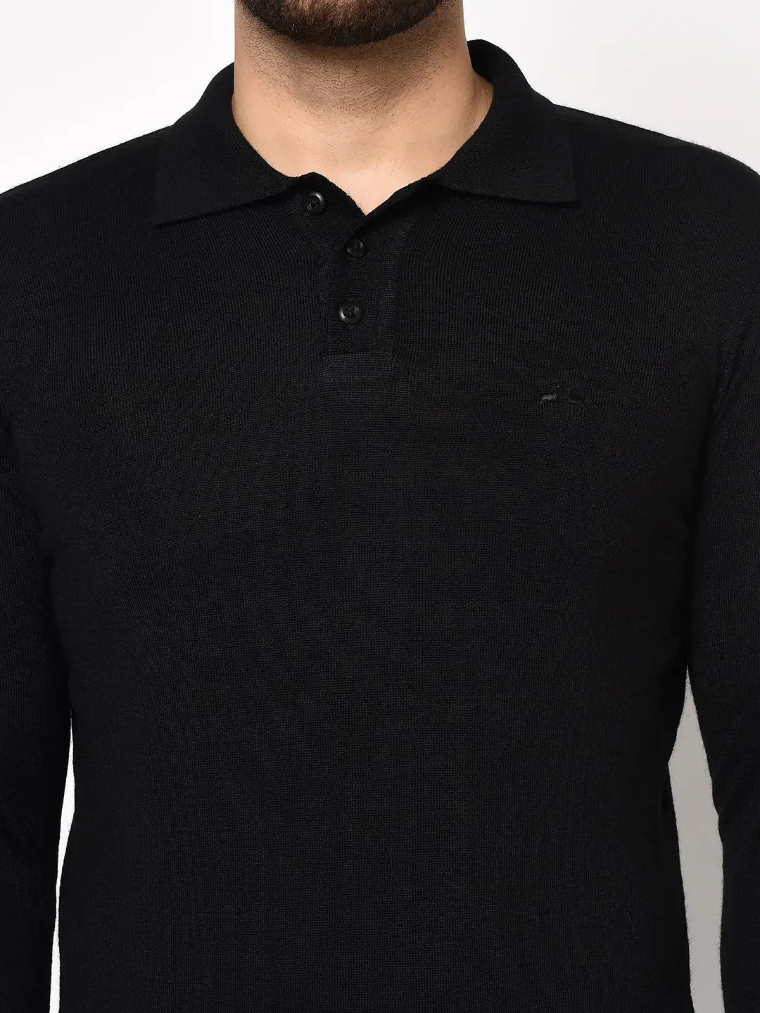 A man wears the 98degreenorth Men’s Black Premium Merino Wool Polo Neck Sweater, shown from shoulders to waist.