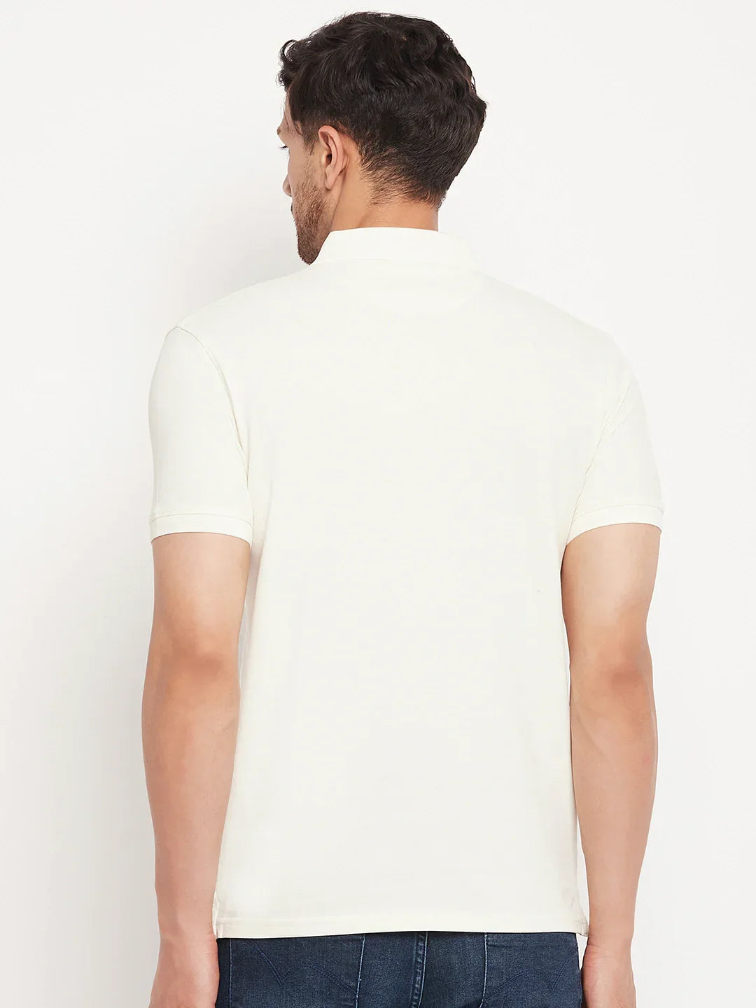 Man in 98degreenorth Butter Yellow Vertical Striped Polo T-Shirt, facing away against a plain background.
