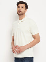 Man in 98degreenorth Men's Butter Yellow Vertical Striped Pique Knit Polo T-Shirt and blue jeans on white background.
