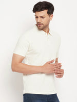 Man in a 98degreenorth men's butter yellow vertical striped polo tee, looking down left against a white background.
