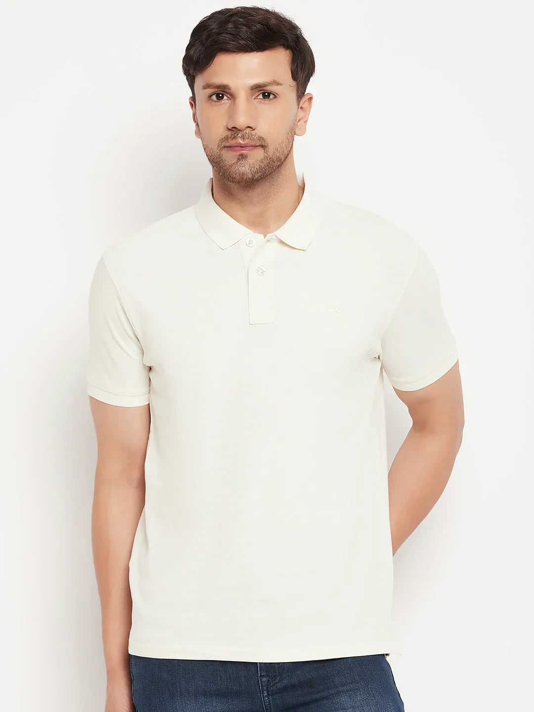 Man wearing 98degreenorth's butter yellow vertical striped polo T-shirt, pique knit, against a white background.