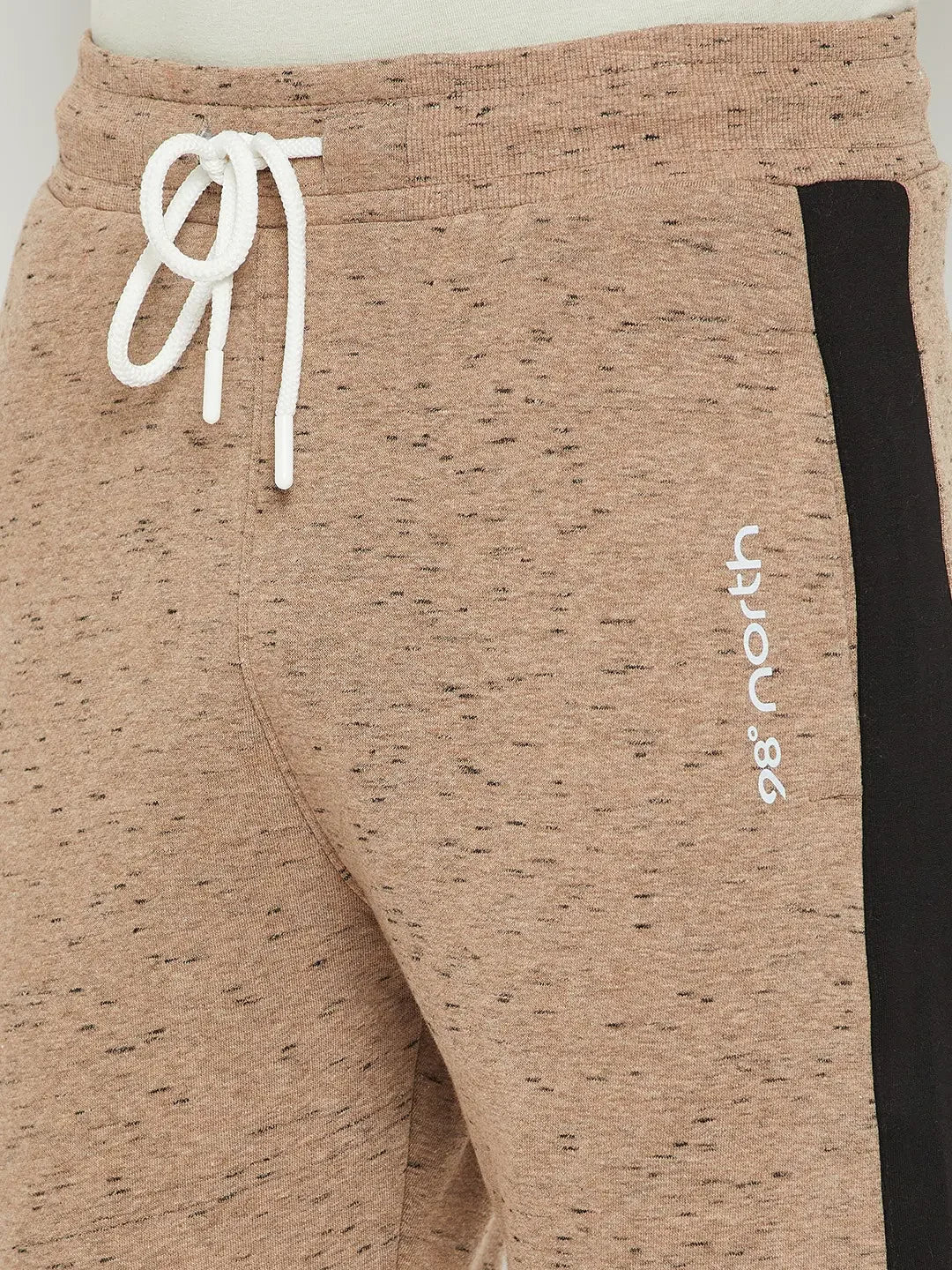 Close-up of 98degreenorth Men’s Camel Fleece Trackpants with black stripe, white drawstring & printed text.