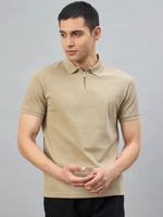 Man wearing the 98degreenorth Men's Camel Quarter Zip Polo T-Shirt—Popcorn Knit, against a gray background.