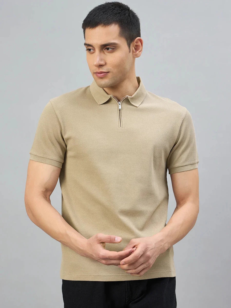 Man wearing the 98degreenorth Men's Camel Quarter Zip Polo T-Shirt—Popcorn Knit, against a gray background.