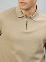 A man in the 98degreenorth Men's Camel Quarter Zip Polo T-Shirt, shown from shoulders to mouth against a plain background.