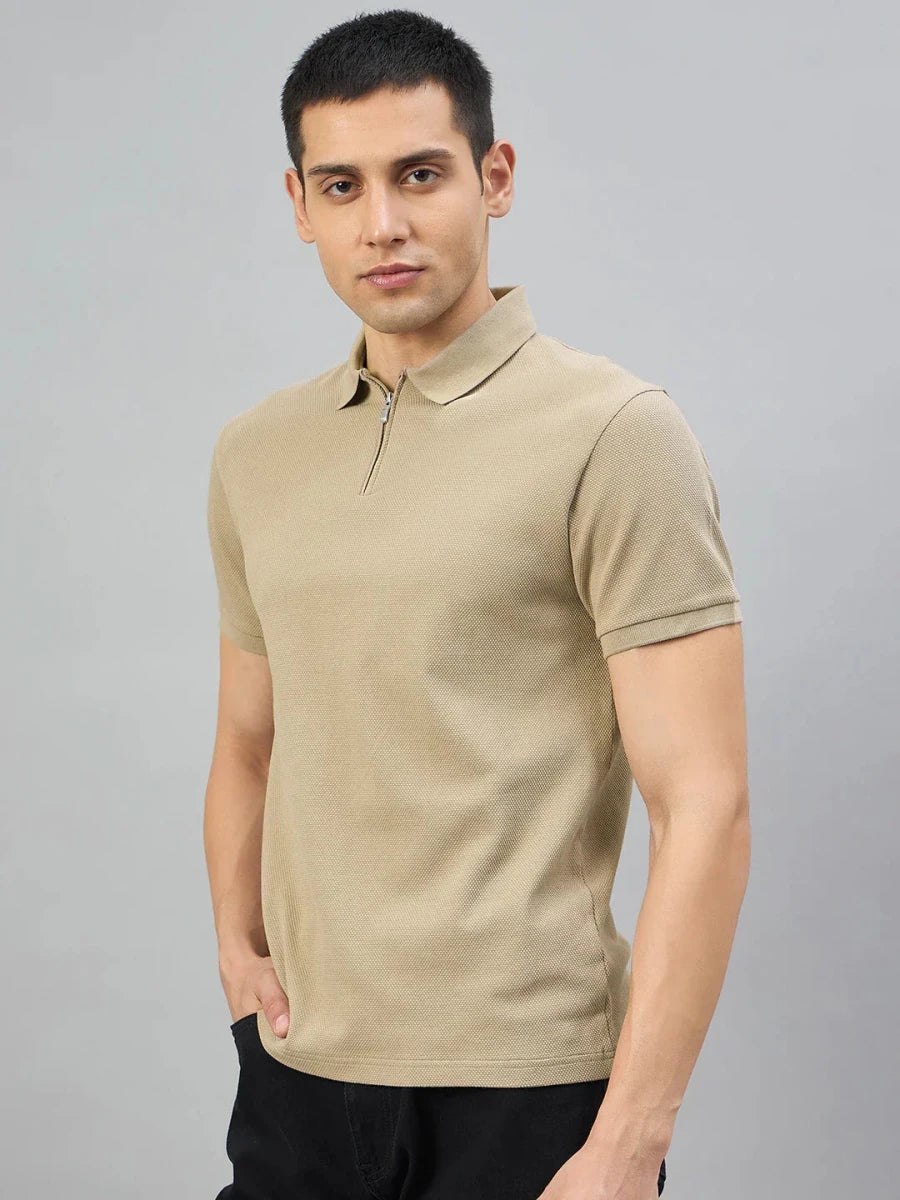 A man in a 98degreenorth Men's Camel Quarter Zip Polo T-Shirt stands against a plain gray background.