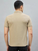 A man wears the 98degreenorth Men's Camel Quarter Zip Polo T-Shirt, shown from the back against a plain background.